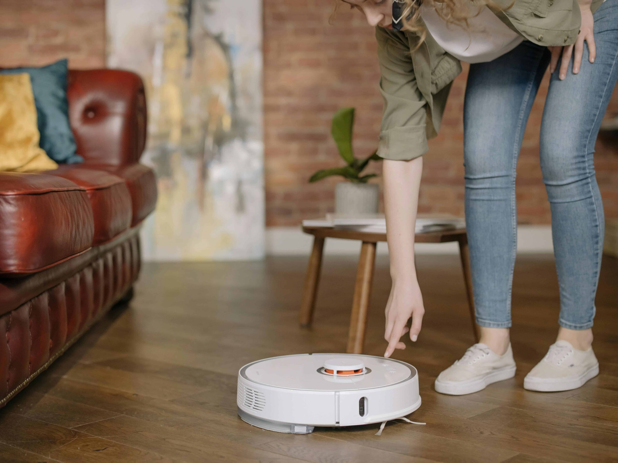 Lady switch on robot vacuum